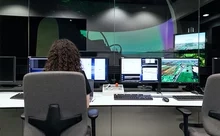 woman sat at monitors